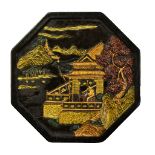 A Chinese octagonal ink stone coloured and gilt heightened to moulded decoration depicting figural
