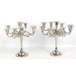 A pair of chromed eight-branch candelabra with beaded detail on spreading circular feet (2).