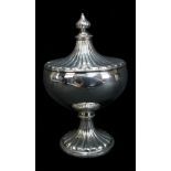 HOLLAND, ALDWINCKLE & SLATER; a George V hallmarked silver lidded sugar bowl with gadrooned detail