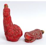 Two Chinese carved coral snuff bottles, height 7.5cm and 5.5cm (2).