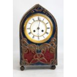 A copper clad Arts and Crafts mantel clock, the two piece white enamel dial set with Roman