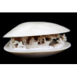 RYUGYOKU; a Japanese carved ivory clam 'Dream Shell', signed, length 9cm.Additional