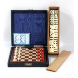 A cased travelling chess set with board, all pieces and instructions and a wooden cased set of