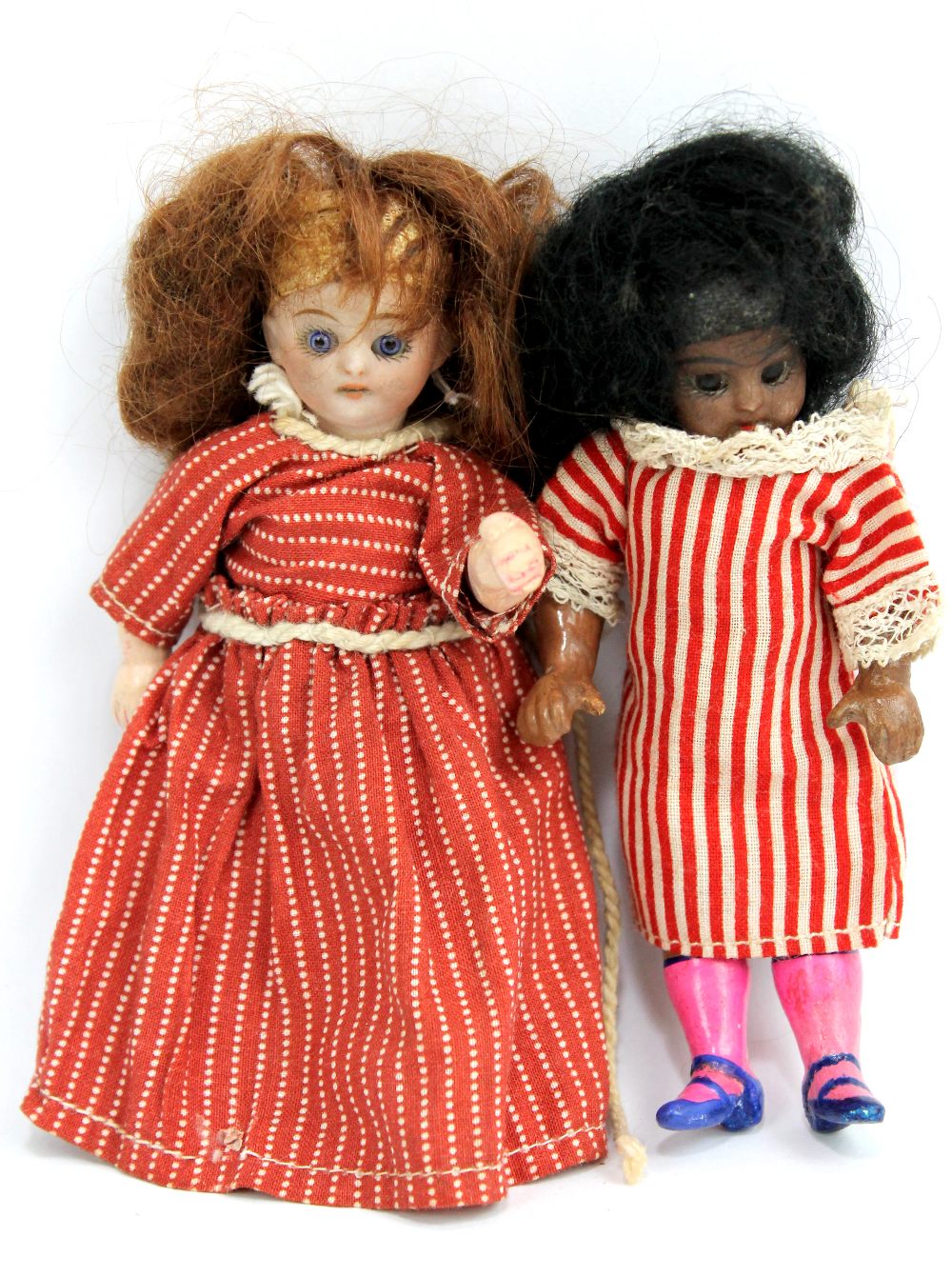 Two bisque headed dolls' house dolls with composite body in original clothes (2). Additional