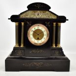 A late 19th century French black slate mantel clock with circular dial set with Arabic numerals,