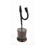 An 18th century wrought iron rush light with turned oak base, height 26cm.