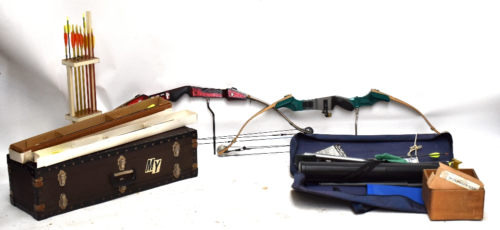 A group of archery equipment to include two compound bows, a Merlin Target Master 3, a Crusader