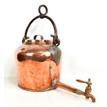 A large Victorian copper kettle with wrought iron swing carry handle and brass tap, height approx