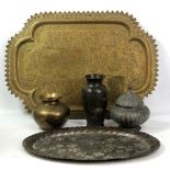 A small group of Eastern metalware including a copper globular jar and cover, brass vase, two