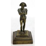 A 19th century brass figure of Napoleon on square stepped base, height 15cm.