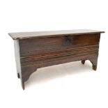 A late 17th century oak six-plank coffer with two-piece hinged top, linear moulded decoration to the