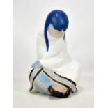 LLADRO; a large figure of a girl wrapped in a blanket, height 31cm, impressed mark to base E-20.