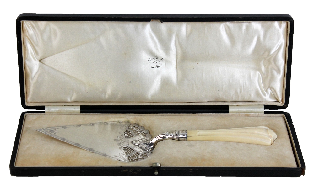A cased Edward VII hallmarked silver Art Nouveau cake slice with carved ivory handle and pierced