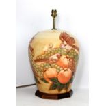 MOORCROFT; a large ochre ground tubeline decorated 'Finches' pattern lamp base on octagonal wooden