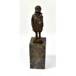 A decorative bronze figure of a boy in coat, shorts and boots, no. A2358 and impressed 'ManGreB'