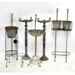 A group of garden ornaments including a pair of bird feeding troughs, one set with a tap, other