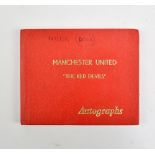 An autograph album containing five autographs of George Best, Bobby Charlton, Matt Busby, Malcolm