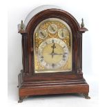 WINTERHALDER & HOFMEIER; a circular 1900 mahogany mantel clock, with repeating twin fusee