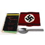 A Third Reich SS armband, a Third Reich spoon with stamped eagle over Swastika device and mark '