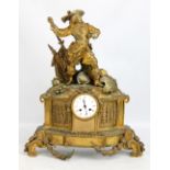 A large decorative gilt metal mantel clock, the white enamel dial set with Roman numerals and