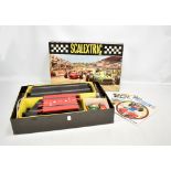 A boxed Scalextric Model Motor Racing set with three cars, track and booklet (playworn).Additional