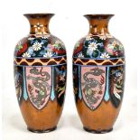 A pair of early 20th century Japanese cloisonne enamel orange ground vases decorated with floral