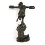 A late 19th century novelty bronze candle holder modelled as a bear with arms outstretched sitting