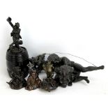 A small Japanese bronze figure, a bronze of a toad upon lilypad, and other bronzed items including a