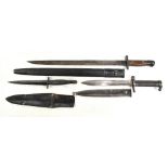 A Fairbairn-Sykes type commando dagger with blackened blade and ribbed grip, length 29cm, with