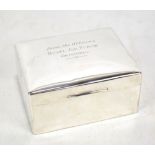 WALKER & HALL; an Elizabeth II hallmarked silver cigarette box of rounded rectangular form,