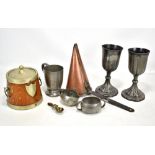 A small group of metalware including Tudric hammered pewter mug, cream jug and twin handled sugar