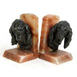 LECOURTIER; a pair of bronzed spelter and onyx dog head bookends, height 20cm.