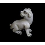 A Japanese Meiji period carved ivory netsuke of a dog, length 3.5cm.