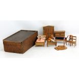 A set of 19th century German dolls' house wooden furniture including a wardrobe, crib etc, circa