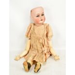 A Kammer Reinhardt, Simon & Halbig 403 bisque head doll with blonde wig, open and close eyes, open