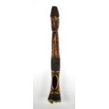 A late 19th/early 20th century African stained ivory figural flute (lacking sound box), length