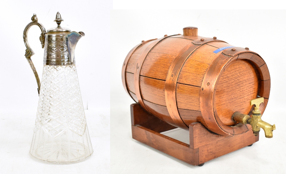 A coopered oak barrel with copper straps and a glass and silver plate mounted jug (2).