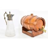A coopered oak barrel with copper straps and a glass and silver plate mounted jug (2).