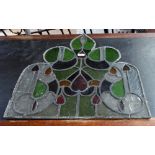 An Art Nouveau leaded stained glass panel, height 68.5cm.