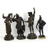 A pair of spelter figures and two further figures of warriors (4).
