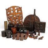 A group of treen including a pipe rack, tobacco jars, carved plaques, etc.