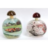 Two modern Chinese scent bottles, one decorated with cats, the other featuring a Hispano- Suiza