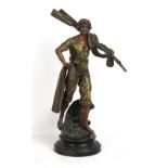 A late 19th century French spelter figure of a fisherman holding netting right hand and oars over