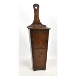 A late 18th century oak candle box with leather strap hinged lid and faint incised decoration to the