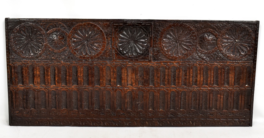 A late 17th century carved oak panel, formerly the front of a coffer, 88 x 38.5cm.