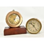 Two car clocks; the first with brass case set with Arabic numerals on associated rectangular