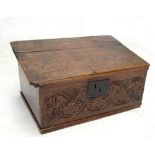 An early 18th century Bible box with chip carved side mouldings, stylised floral carved front panel,