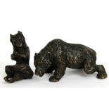 A late 19th century bronze figure of a bear standing foursquare, length 9.5cm, and a further