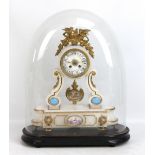 A late nineteenth century French alabaster eight day mantel clock with associated painted lower