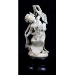 A late 19th century carved ivory Indian figure of a female dancer wearing elaborate dress and